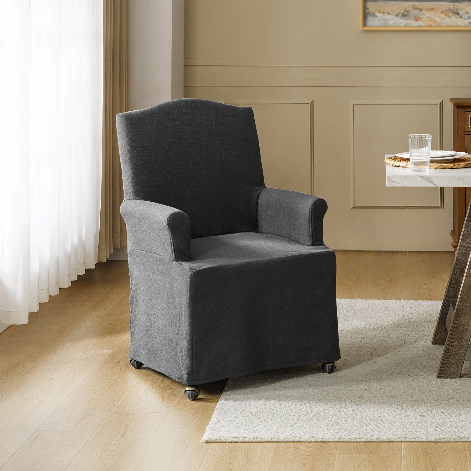 Kanrad Slipcover Dining Chair with Casters in Charcoal