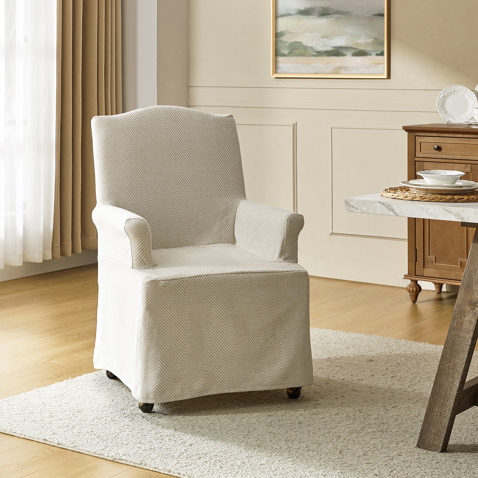 Kanrad Slipcover Dining Chair with Casters in Tan